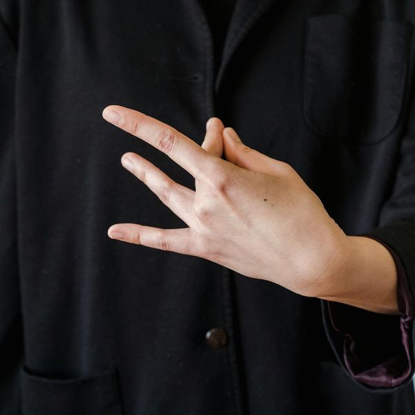Close up of hands in a mudra position
